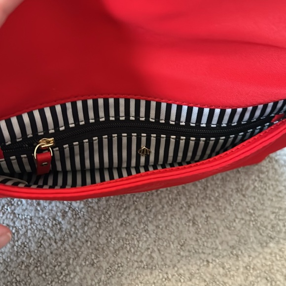 Kate Spade Red cross body purse. Fold over flap style. Zip pocket on front. - Picture 7 of 14